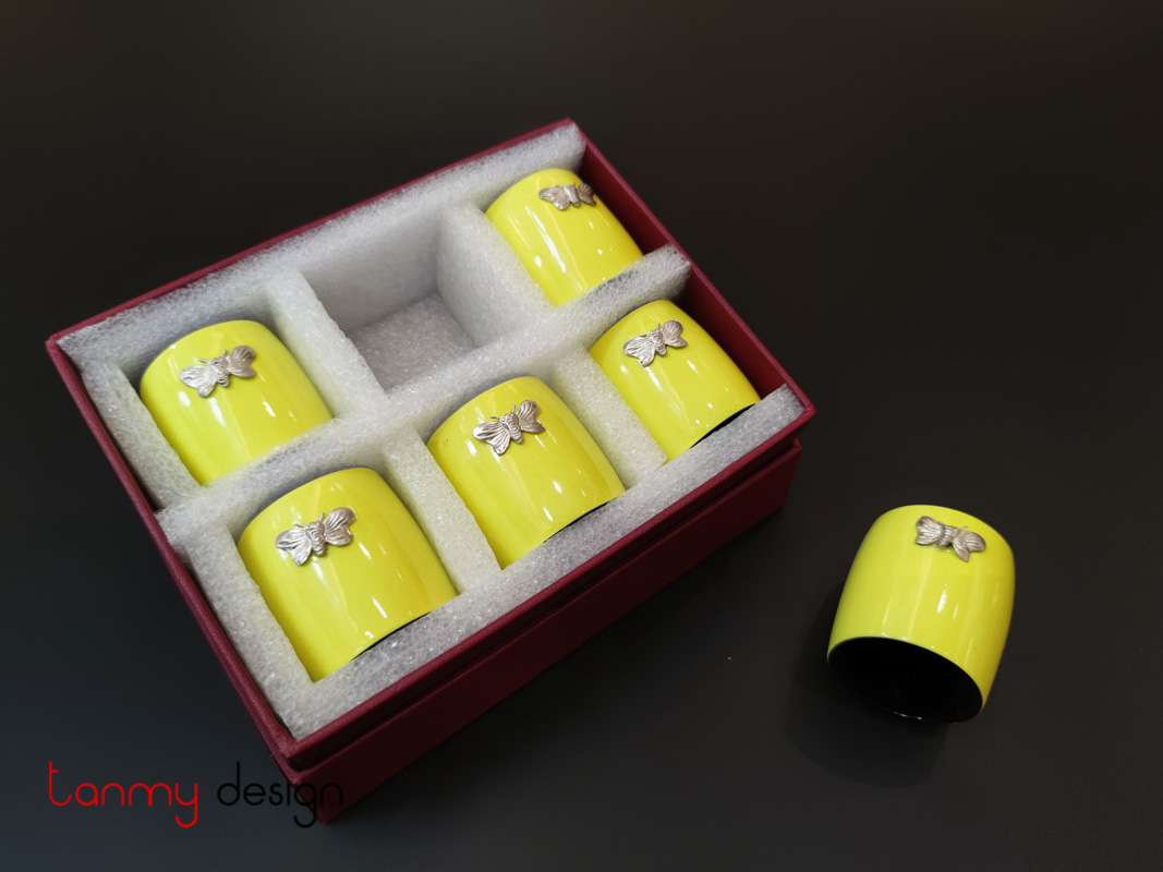 Set of 6 yellow napkin rings attached with butterfly